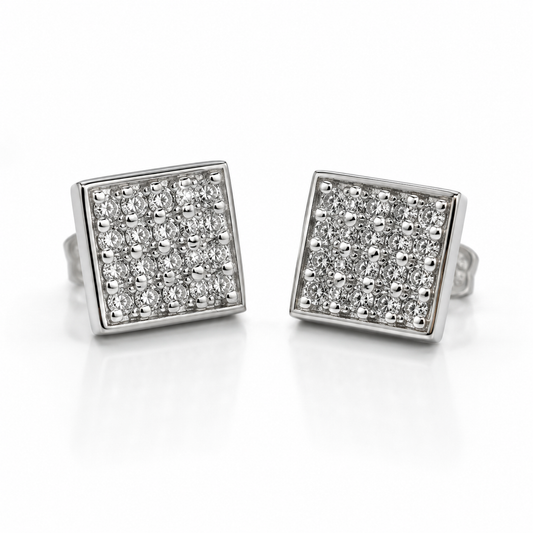A pair of square stud earrings with pavé-set clear stones in a silver-tone frame, displayed on a clean white background.